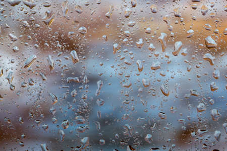 bright abstract background of water drops on glassの写真素材