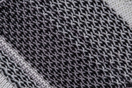 decorative background of the knitted fabric closeup