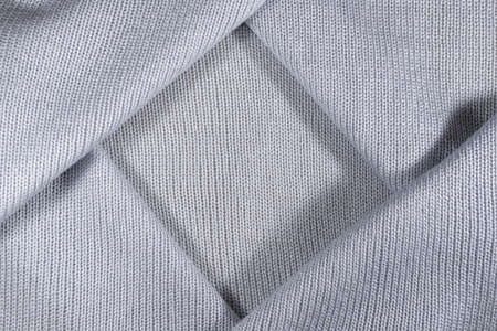 decorative background of the knitted fabric closeupの写真素材