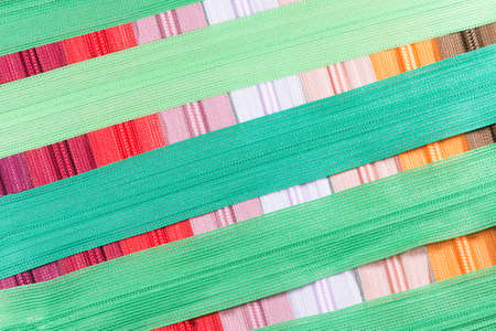 sewing accessories on the background of denim closeupの写真素材