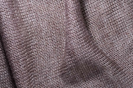 decorative background of the knitted fabric closeup