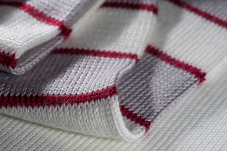 decorative background of the knitted fabric closeup