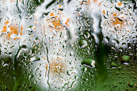 bright abstract background of water drops on glassの写真素材