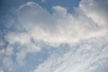 bright sun lit the clouds in the skyの写真素材