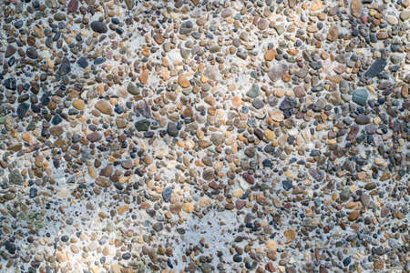 the texture of the wall surface of small stonesの写真素材