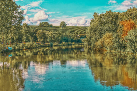 Colorful Autumn River Scene in Rural Landscapeの写真素材