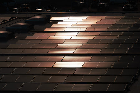 Solar Panels on Rooftop Reflecting Sunlight in Neat Rows
