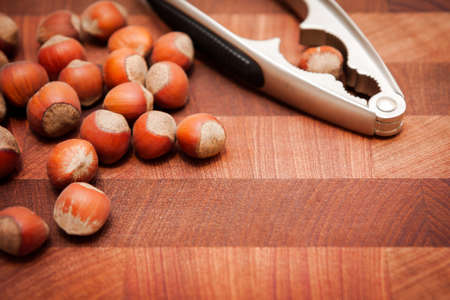 nuts and nutcracker on wooden backgroundの写真素材