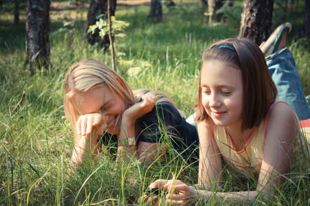 Family having fun on grassの写真素材