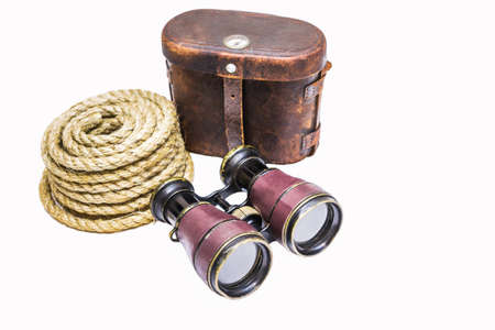 Antique binoculars with rope and leather case  isolated on whiteの写真素材