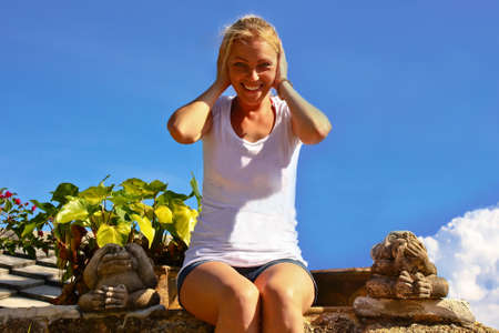 Young woman see hear speak no evil