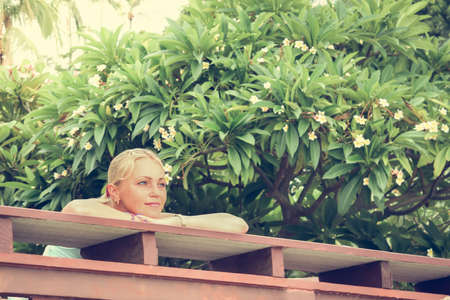 Young woman admiring beautiful view on holidaysの写真素材