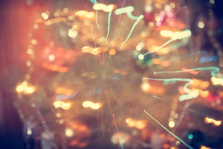 Abstract colorful sparkling Christmas lights on Christmas tree in retro style as Christmas backgroundの写真素材