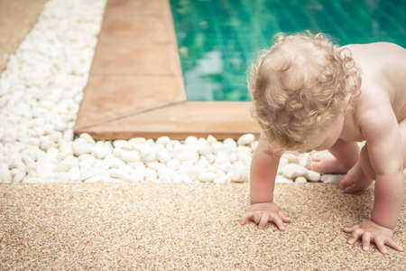 Baby making efforts to get up with copy spaceの写真素材