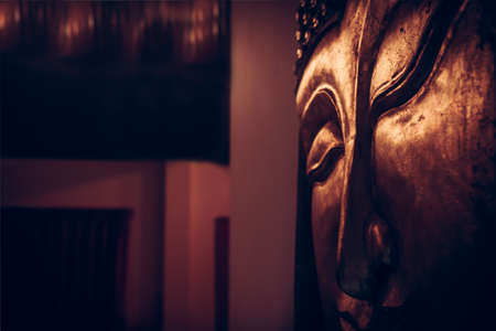 Asian style interior background with wooden picture of Buddha faceの写真素材