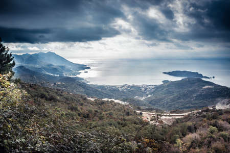 Mountains landscape on sea coast  with dramatic sky in overcast day in Europe country Montenegroの写真素材