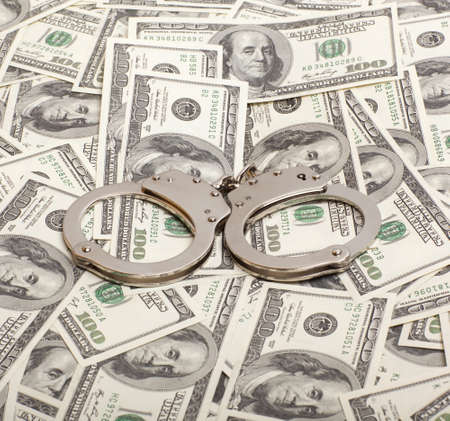 Handcuffs on money background   Criminal concepts