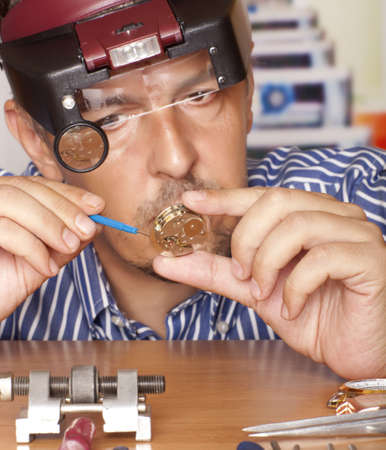 Watch repair craftsman repairing watch  Focus on watchの写真素材