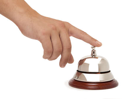 Hand of a man using a hotel bell isolated の写真素材