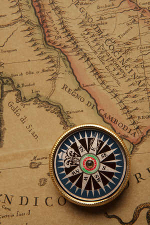 Old compass and rope on vintage mapの写真素材