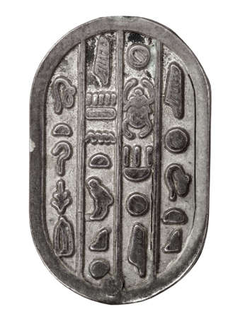 Old silver egyptian brooch in isolated on white  Super macroの写真素材