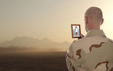 Conscript  marine looks at the photo of the girlfriend の写真素材