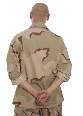 Soldier in camouflage standing on a white backgroundの写真素材