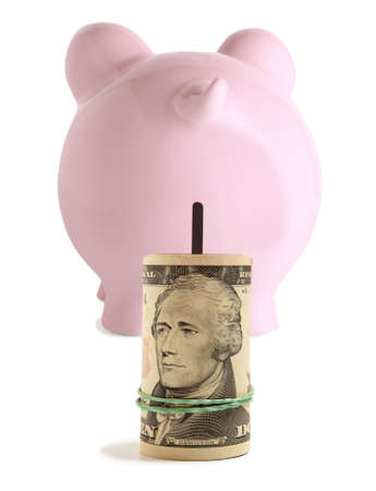 Piggy bank and twenty dollar isolatedの写真素材
