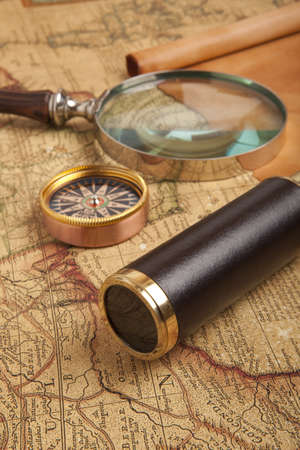 Vintage brass telescope on antique mapの写真素材