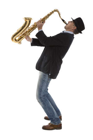 Full length portrait of a man playing on saxophone isolated on background の写真素材