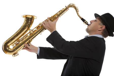 Portrait of a man playing on saxophone isolated on background の写真素材