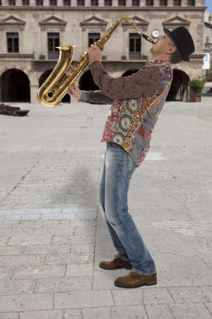 Saxophonist. Portrait of a man playing on saxophone の写真素材
