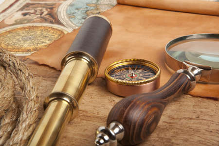 Vintage brass telescope on antique map
