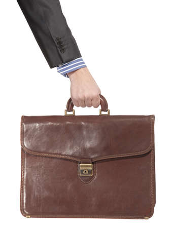 Businessman holding in hand a briefcase . Isolated on white backgroundの写真素材