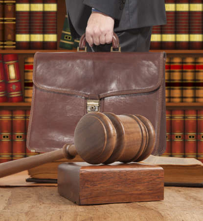 Lawyer with a brown briefcase in the courtroomの写真素材
