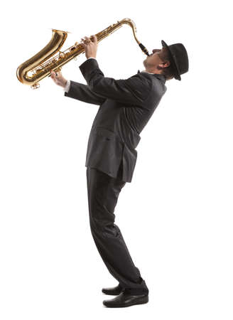 Saxophonist. Middle aged man playing on saxophone isolated on background