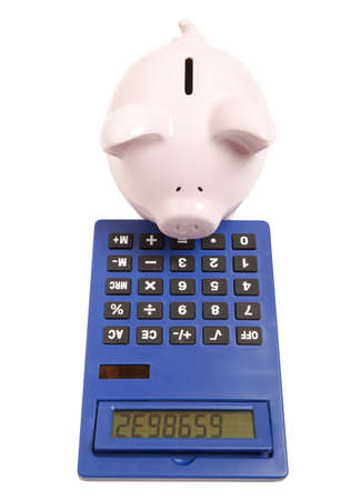 Piggy bank and calculator isolated on white background の写真素材