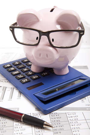 Pink piggy bank and calculatorの写真素材