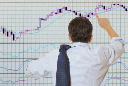 Stock trader looking at monitors 