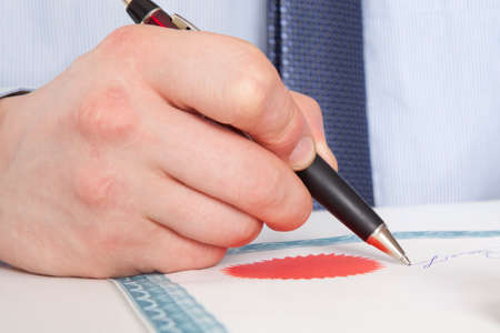 Lawyer, notary signs the documents from our office