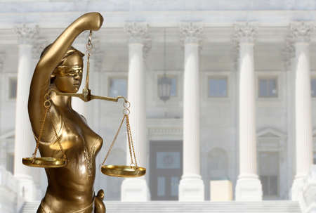 Justice statue is on against the courthouse Justice statue is on against the courthouse