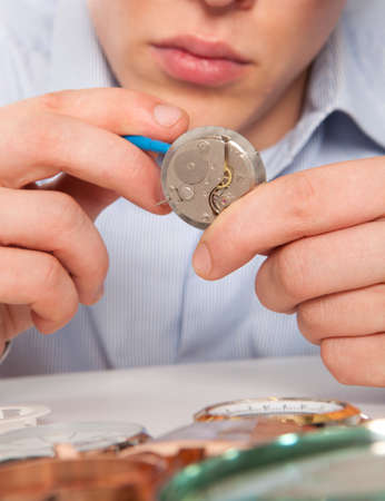 Watchmaker. Watch repair craftsman repairing watch の写真素材