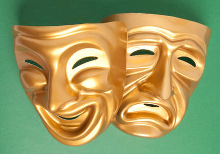 Comedy and Tragedy theatrical mask on a green background の写真素材