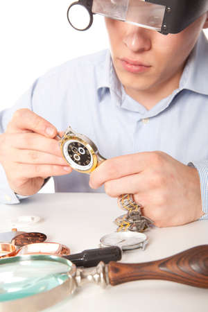 Watchmaker. Watch repair craftsman repairing watch の写真素材