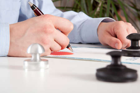 Lawyer, notary signs the documents from our office
