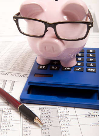Pink piggy bank and calculator の写真素材