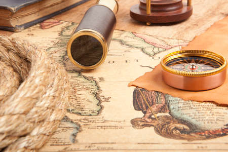 Vintage brass telescope on old antique map 