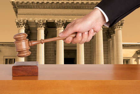 Gavel against the background of the courthouse