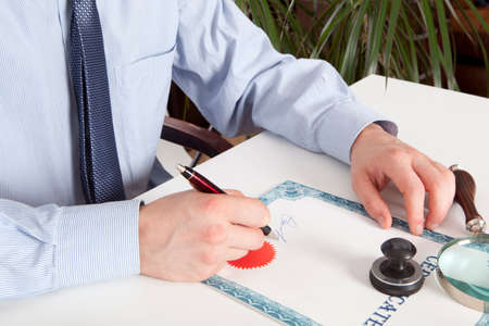Lawyer, notary signs the documents from our office