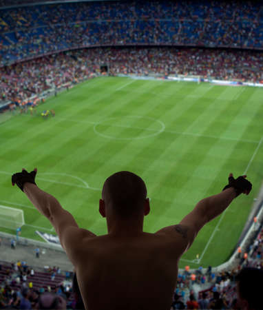 Happy soccer fans in the stadiumの写真素材